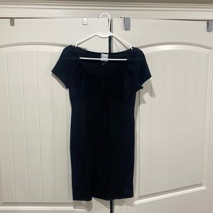 black tight fitting mini dress with sweetheart neckline